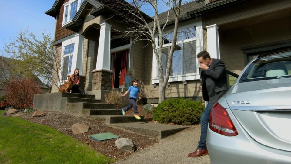 A family leaving their house in the morning, from a dental practice commercial.